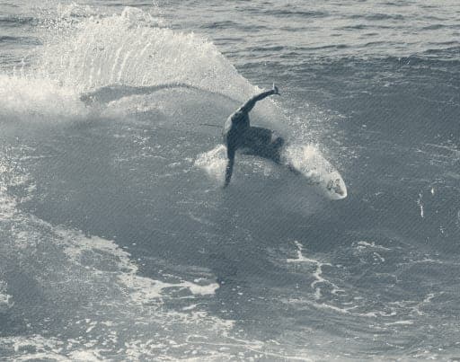 Ryan Ragan throwing the tail through the lip of a wave
