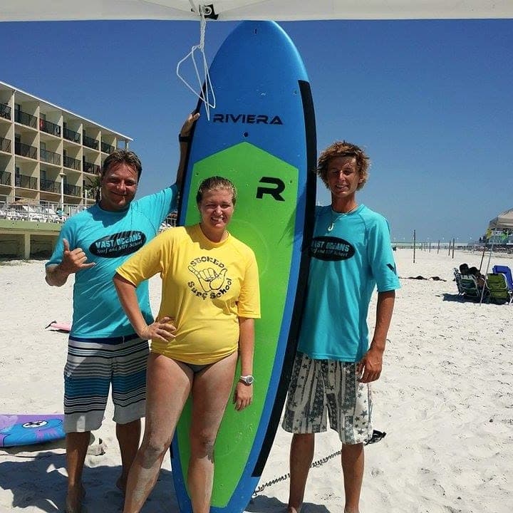 Two instructors and a student together after a lesson