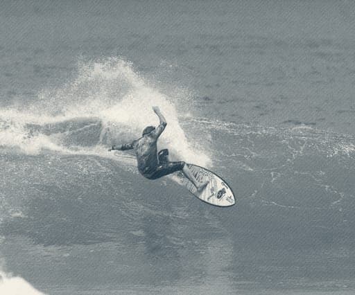 Ryan Ragan laying into a snap on a tiger-print shortboard