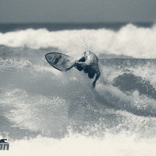 Ryan Ragan blasting a fins-out snap on a yellow board