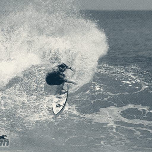Ryan Ragan hacking a frontside turn with spray flying