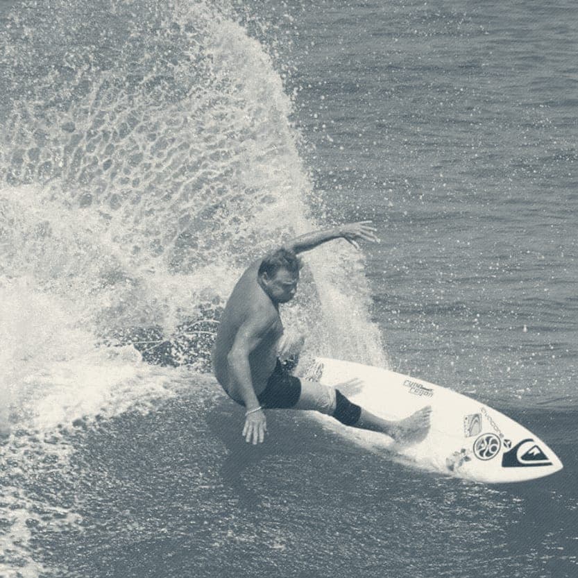 Close-up of Ryan Ragan mid-cutback with fanning spray
