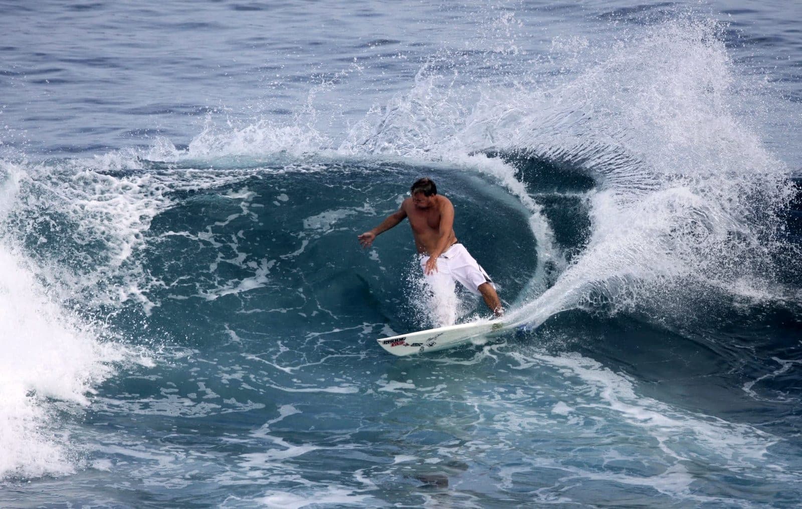 Ryan Ragan carving a hard hack off the top of a wave