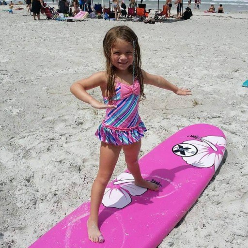 A young Girl Learning to Surf